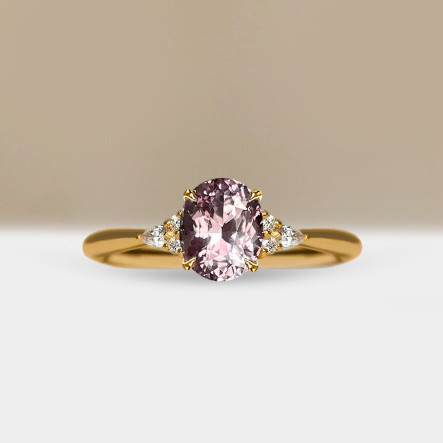 Oval peach sapphire engagement ring