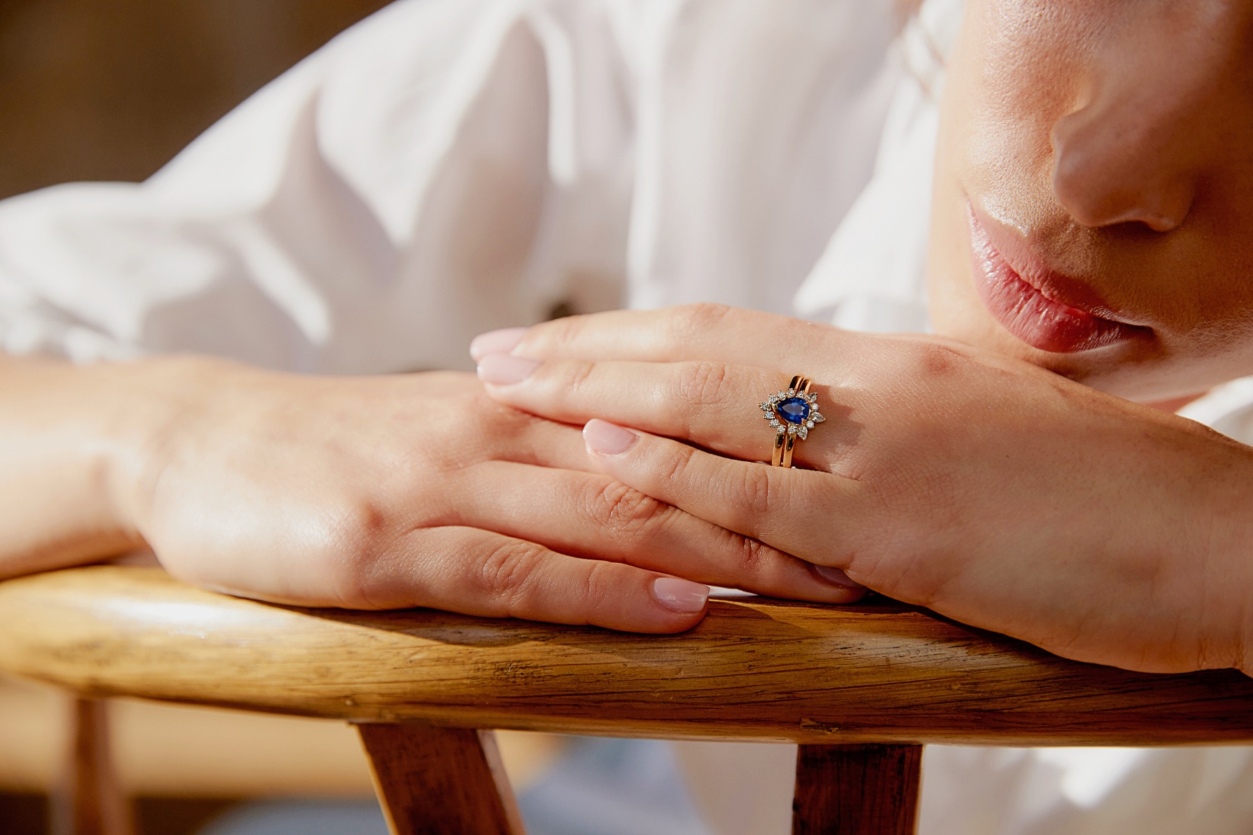 Blue sapphire engagement ring shown in natural light